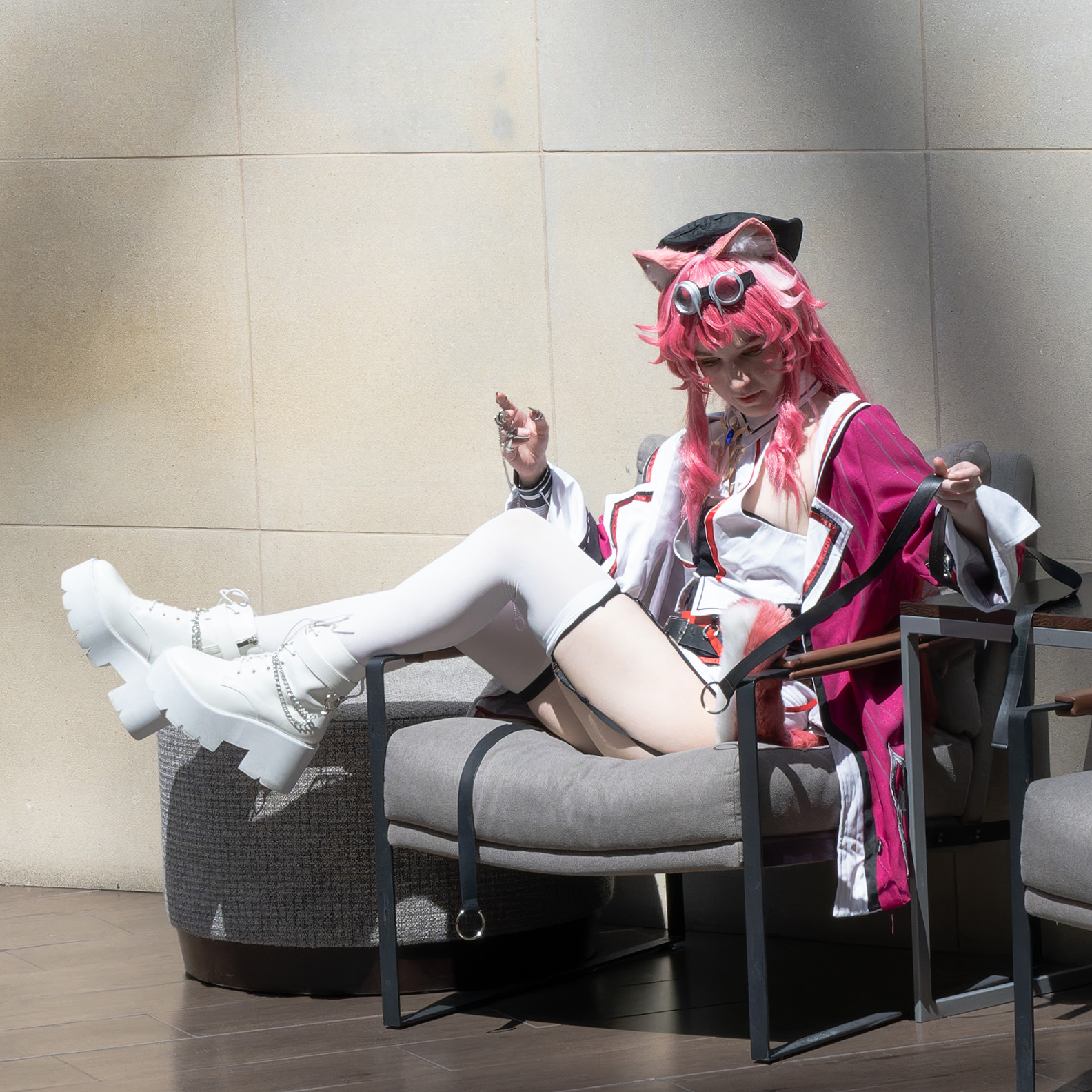 Pink-haired girl in chair