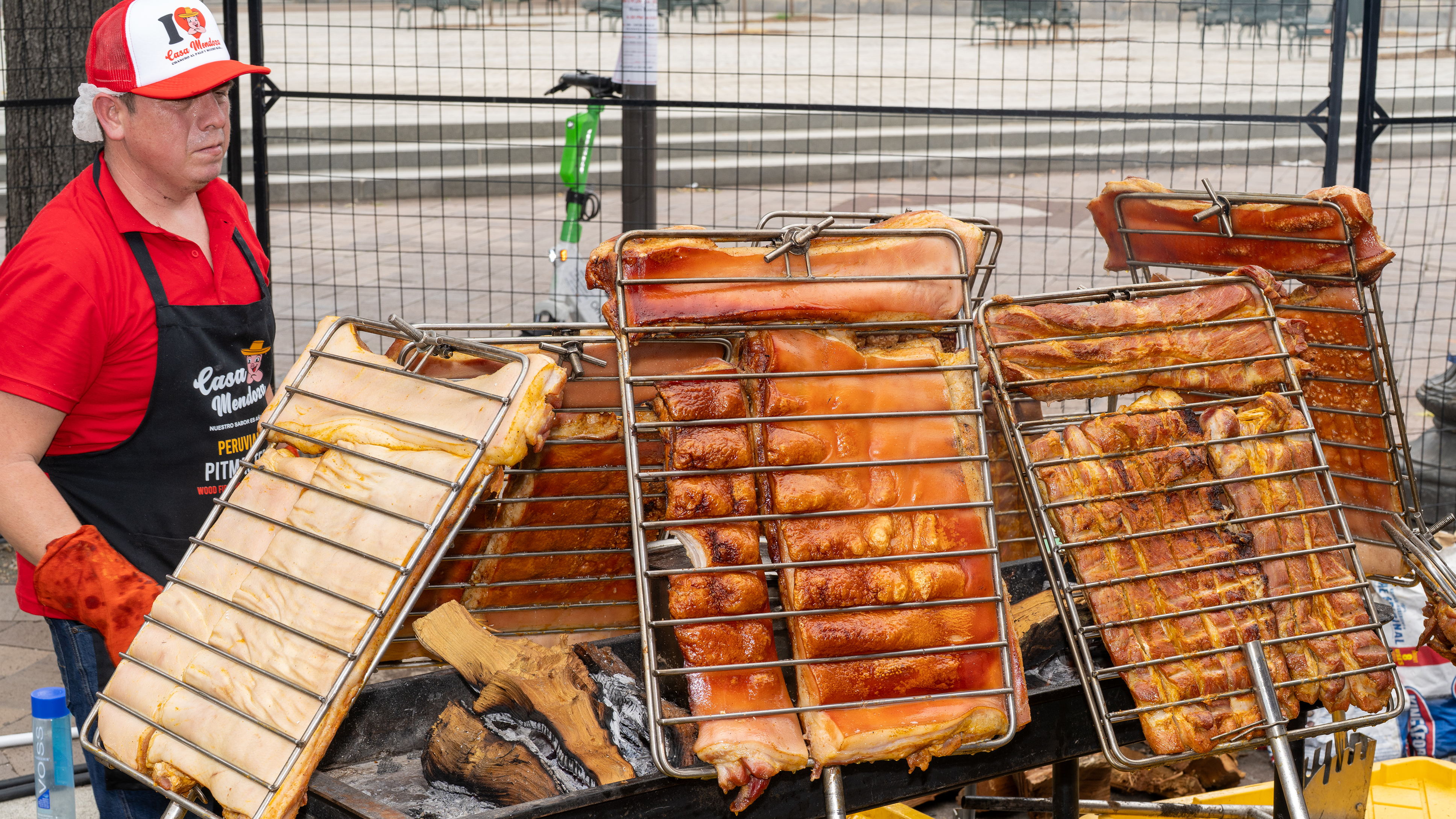 BBQ battle participant with racks of meat