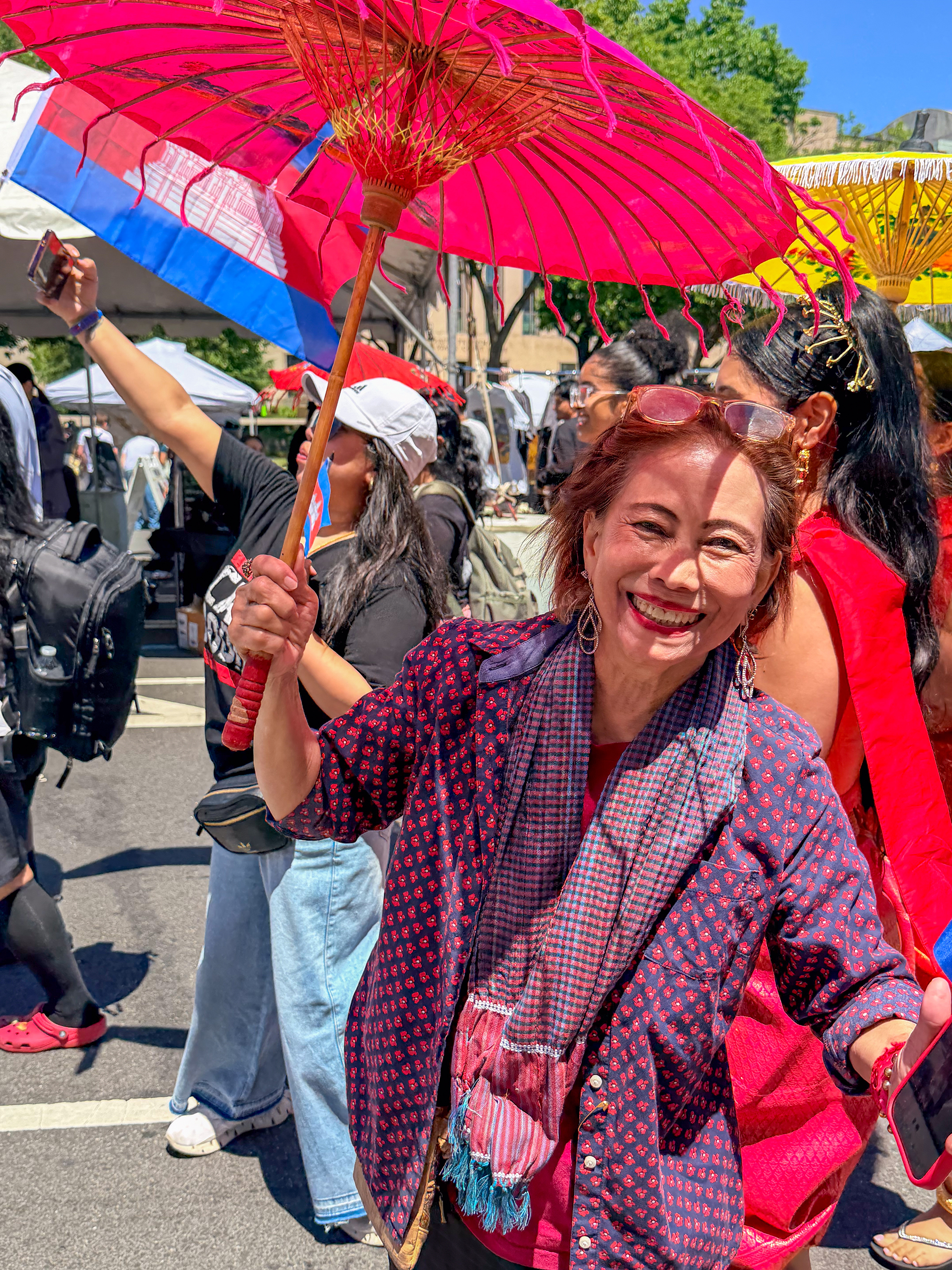 Asian woman with umbrella at Fiesta Asia
