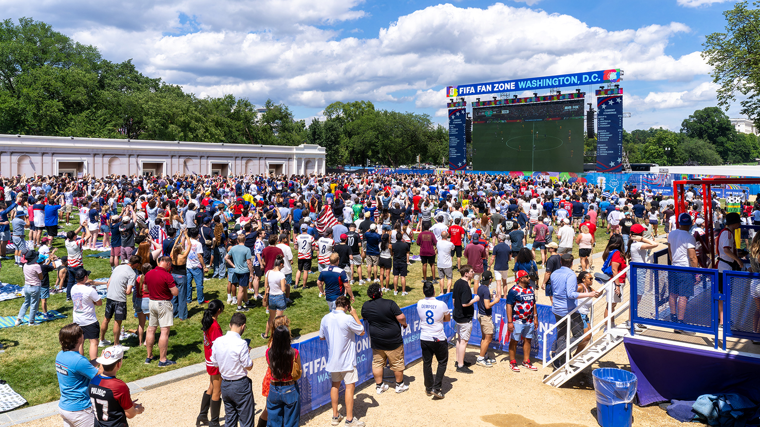 FIFA World Cup Fan Zone with Washington Monument backdrop.