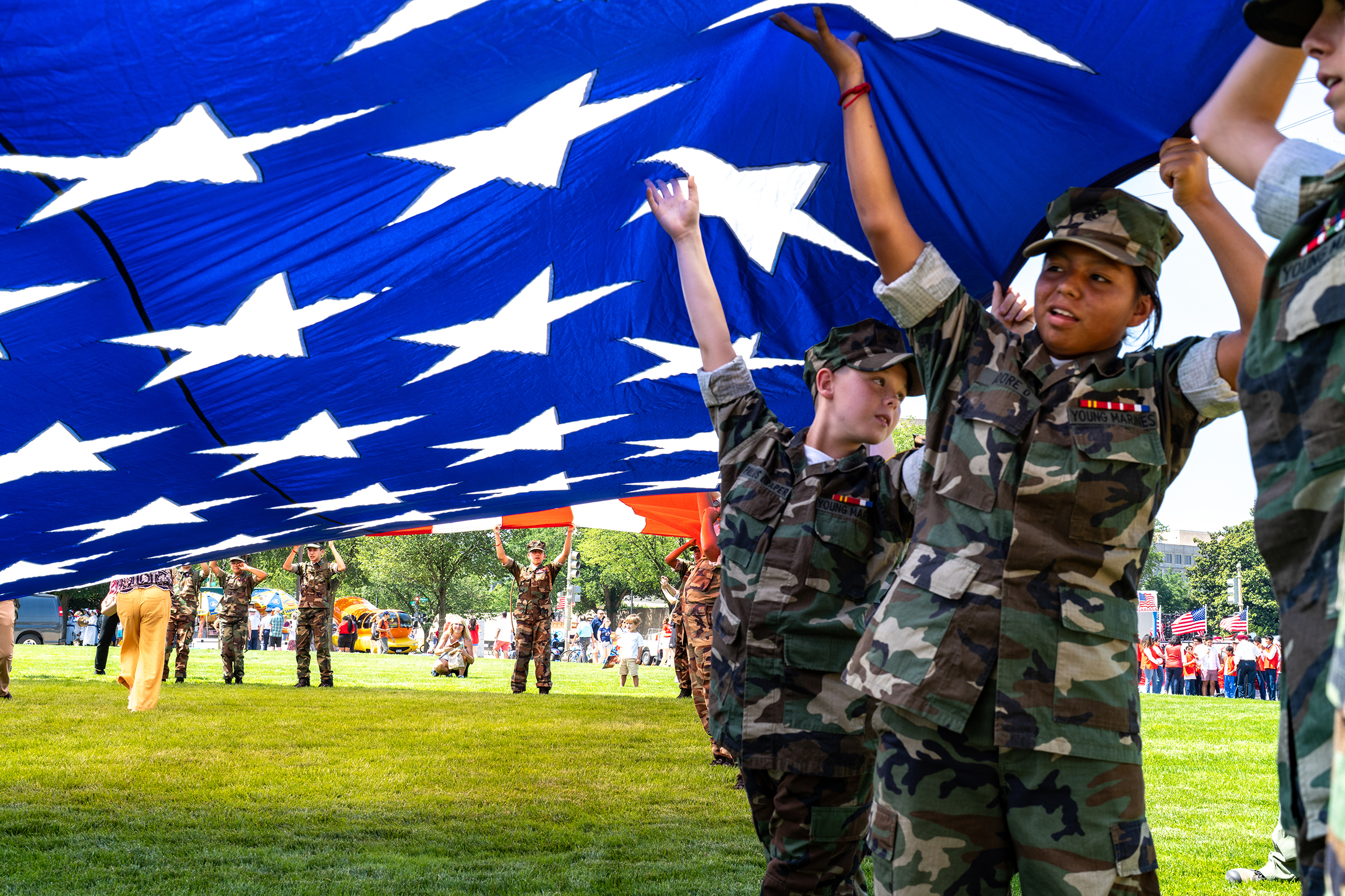 Young Children Holding Up American Flag